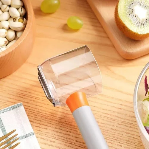 Pelador multifuncional con depósito™ para Frutas y Verduras